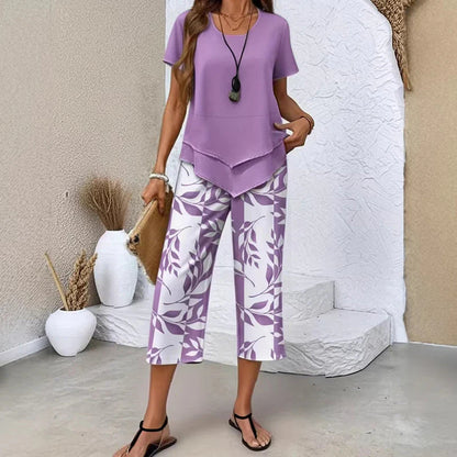 💝49% kedvezmény🎁Ingyenes gyönyörű nyaklánc💜Modern drapírozott tunika szett S–5XL🌿Aszimmetrikus réteges kétrészes szett – Levélmintás nadrág, könnyű légáteresztő viselet!