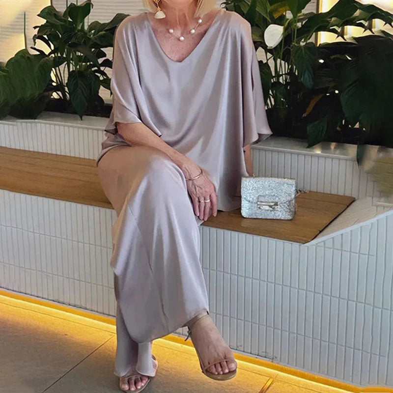 👍2026 Új modell📿Ingyenes gyönyörű nyaklánc🌸Tavaszi női öltöny szett közepes ujjakkal✨Plus size kétrészes alkalmi szett – Fényes luxus anyag, elegáns V-nyakú kialakítás!