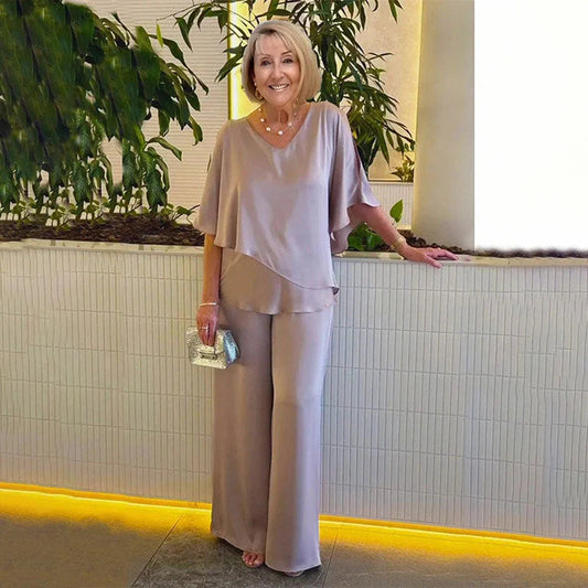 👍2026 Új modell📿Ingyenes gyönyörű nyaklánc🌸Tavaszi női öltöny szett közepes ujjakkal✨Plus size kétrészes alkalmi szett – Fényes luxus anyag, elegáns V-nyakú kialakítás!