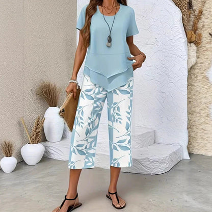 💝49% kedvezmény🎁Ingyenes gyönyörű nyaklánc💜Modern drapírozott tunika szett S–5XL🌿Aszimmetrikus réteges kétrészes szett – Levélmintás nadrág, könnyű légáteresztő viselet!