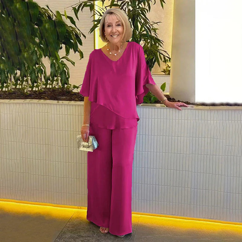 👍2026 Új modell📿Ingyenes gyönyörű nyaklánc🌸Tavaszi női öltöny szett közepes ujjakkal✨Plus size kétrészes alkalmi szett – Fényes luxus anyag, elegáns V-nyakú kialakítás!