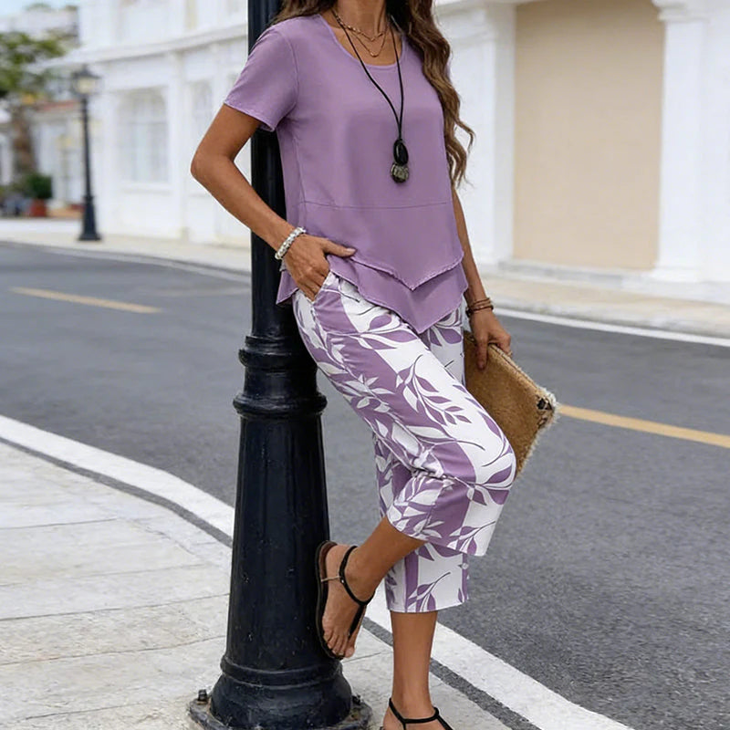 💝49% kedvezmény🎁Ingyenes gyönyörű nyaklánc💜Modern drapírozott tunika szett S–5XL🌿Aszimmetrikus réteges kétrészes szett – Levélmintás nadrág, könnyű légáteresztő viselet!