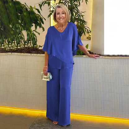 👍2026 Új modell📿Ingyenes gyönyörű nyaklánc🌸Tavaszi női öltöny szett közepes ujjakkal✨Plus size kétrészes alkalmi szett – Fényes luxus anyag, elegáns V-nyakú kialakítás!