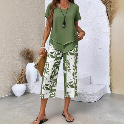 💝49% kedvezmény🎁Ingyenes gyönyörű nyaklánc💜Modern drapírozott tunika szett S–5XL🌿Aszimmetrikus réteges kétrészes szett – Levélmintás nadrág, könnyű légáteresztő viselet!